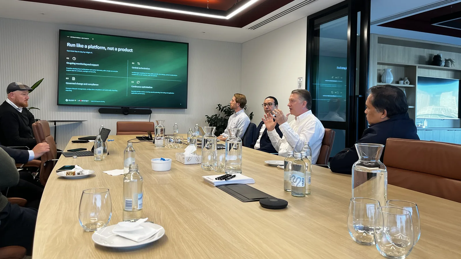 Inlight IT and technology partners in a working session discussing platform operations.